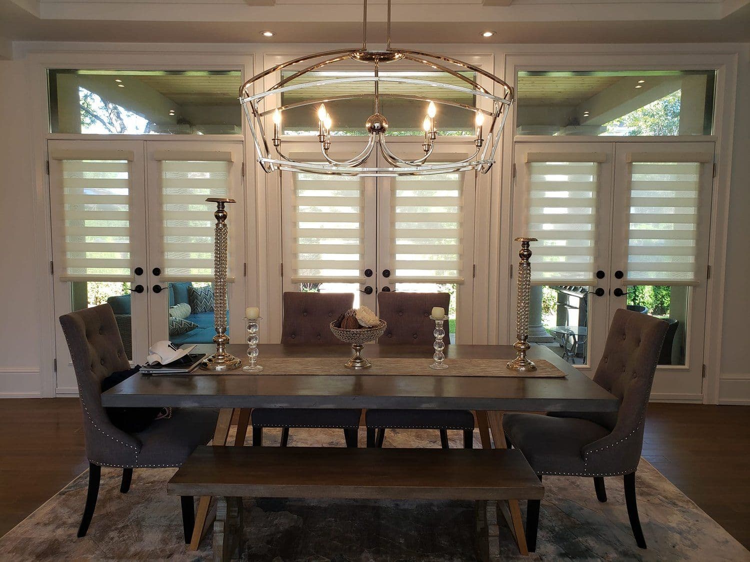 Elegant dining room with chandelier and polished hardwood floors