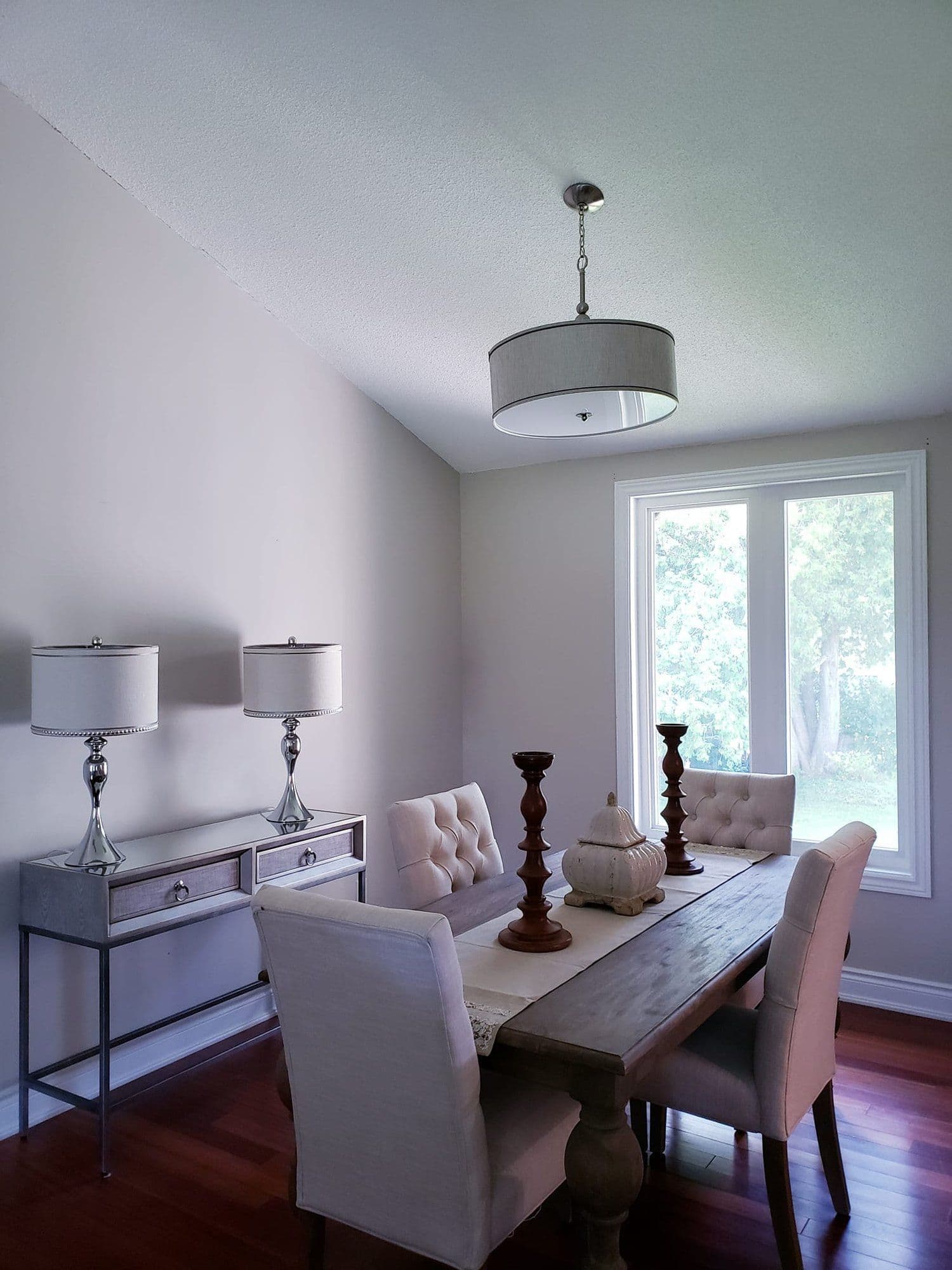 Tidy dining space with neutral palette and natural light