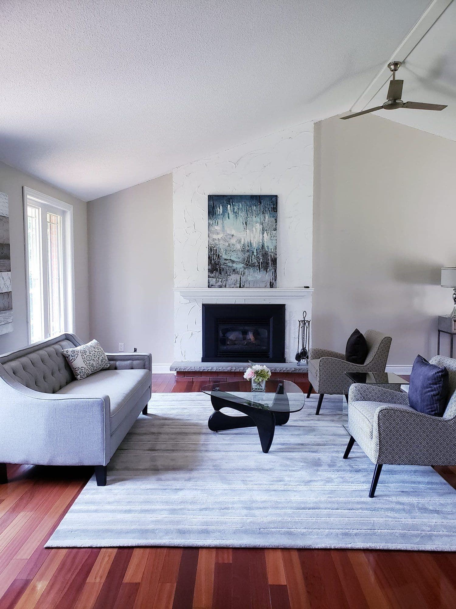 Living room with fireplace and a calm, polished finish